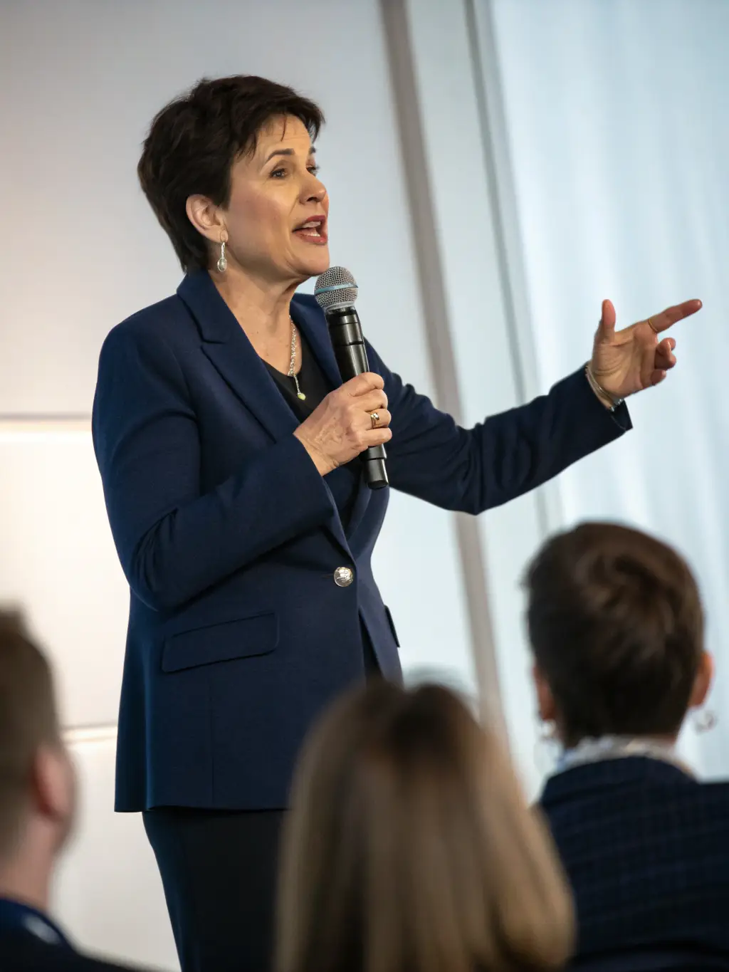 A candid shot of Ms. Chloe Davies during a panel discussion at the 2024 Edinburgh Innovation Conference, actively engaged in conversation with other panelists.